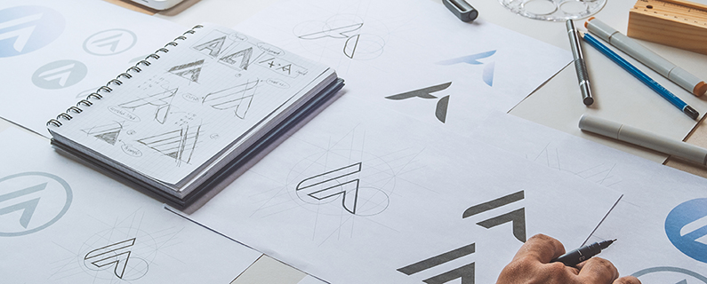 graphic designer sketching many logos
